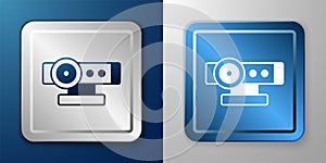 White Web camera icon isolated on blue and grey background. Chat camera. Webcam icon. Silver and blue square button