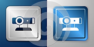 White Web camera icon isolated on blue and grey background. Chat camera. Webcam icon. Silver and blue square button