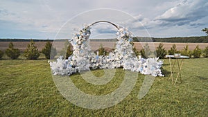 White wedding arch before the ceremony.