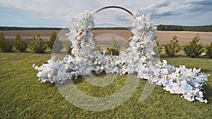 White wedding arch before the ceremony.