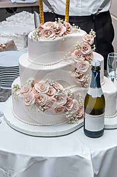 White wedding cake and champagne