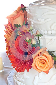 White wedding cake with colorful flowers