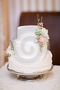 White wedding cake with flowers