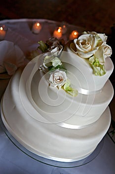 White wedding cake with rose