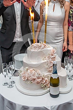 White wedding cake with sparklers