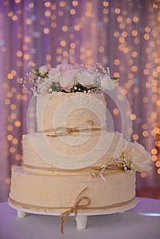 White wedding cake with white roses flower