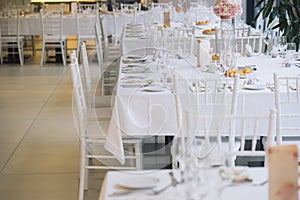 white wedding chairs with decoration
