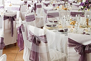 White wedding chairs with ribbon