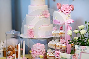 White wedding cupkace cake decorated with flowers