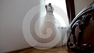 White wedding dress gown on mannequin. Bride`s morning wedding preparation concept