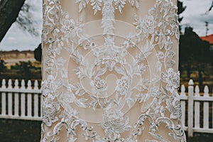 White wedding dress hanging outside
