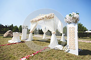 White wedding tent for the ceremony outdoors. Arch. Chairs