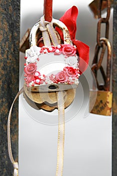 White wedlock with rose and ribbon closeup unsigned