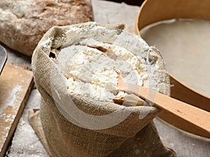 White wheat flour in a small burlap sack