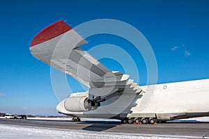 White wide body transport cargo airplane at winter airport