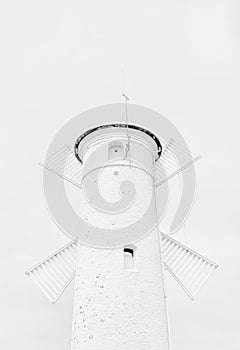 White windmill and lighthouse on a white background
