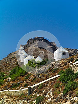 White windmills on a hill