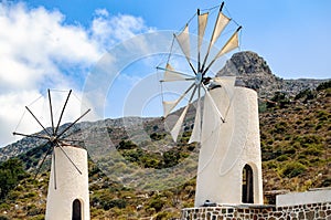 White windmills at sapiens museum in Lassithi district on Crete island, Greece photo