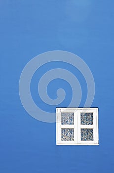 White window, blue wall background