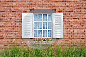 White window and red brick wall