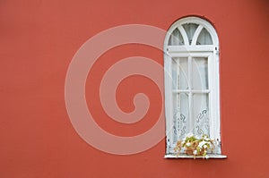 White window on red wall