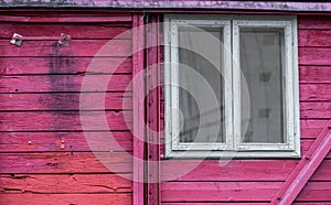 White window on wooden red railway carriage