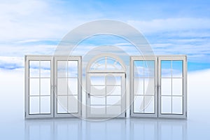 White windows with blue sky and clouds on background