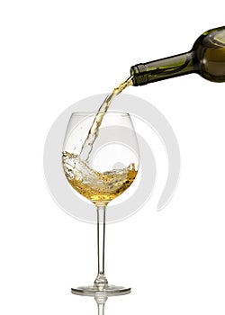 White wine being poured into wine glass