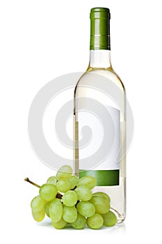 White wine in bottle with blank label and grapes