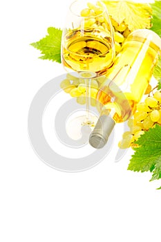 White wine in bottle and glass and a bunch of white grapes isolated on white