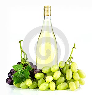 White wine bottle and grapes.
