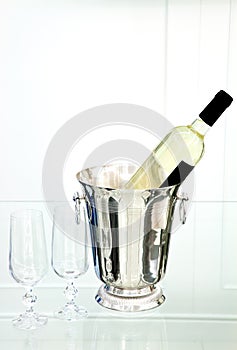 White wine bottle in ice bucket