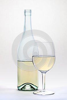 White wine glass and bottle islolated on white background