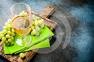 White wine glass with grapes