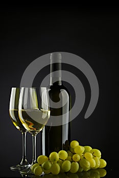 White wine and glass and grapes
