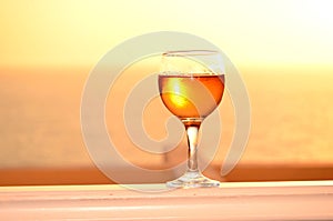 White wine glass on a sunset background