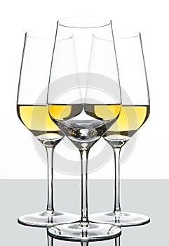 White wine glasses formation set behind each other.