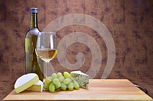 White wine, grapes and cheese