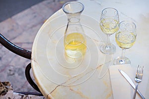 White wine in a liter bottle on a table in a cafe