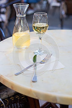 White wine in a liter bottle on a table in a cafe