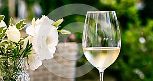 White wine in luxury restaurant on summer garden terrace, wine tasting experience at winery in the vineyard, gourmet