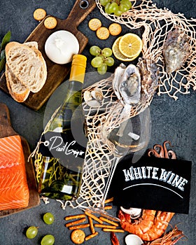 White wine Pinot Grigio with seafood and snacks photo