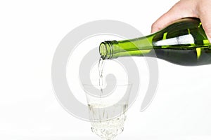 White wine pouring from a bottle