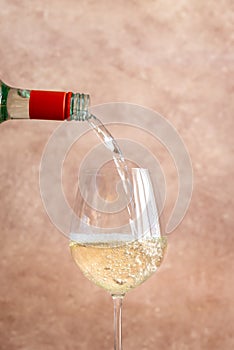 White wine pouring into glass