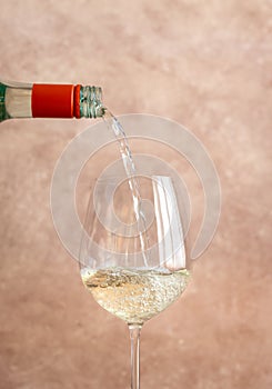 White wine pouring into glass