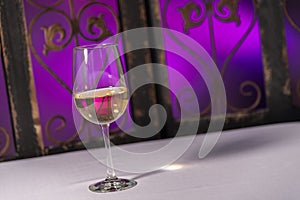 White wine with a purple background