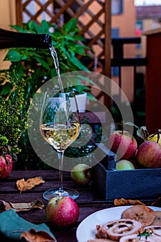 White wine or sider glass on rustic wooden table