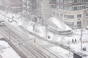 White winter snow fall day in the big apple new york city manhattan buildings streets, cars, people, walkways, subway entrance