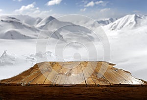 White winter and wooden board backround. Snow and sunny sky background.