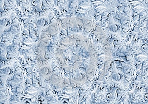 White wintry hoarfrost on window glass photo